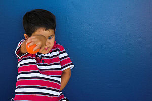 Boy and Blue Wall. 1/60s @ f/4.5