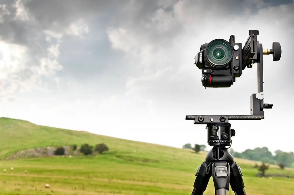 A pano head allows you to take level panoramics by rotating the camera around a fixed point, instead of rotating the camera itself.