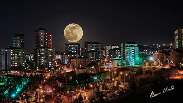 Moon + City Skyline = Success. Photo by Omer Unlu