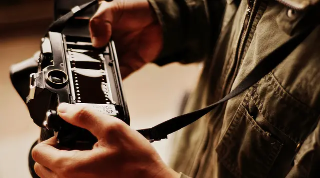 Film must be manually loaded, usually through a door on the back of the camera. Photo by Khanh Hmoong.