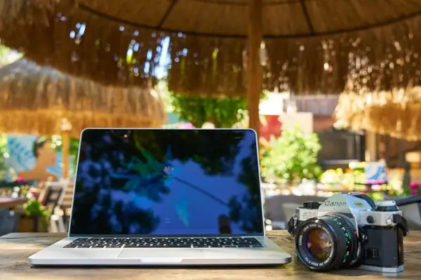 camera and laptop in tropics