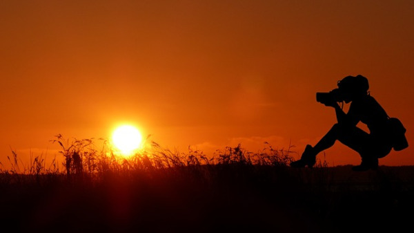 photographer silhouette sunset