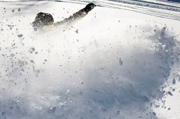 snow thrown from snowboard