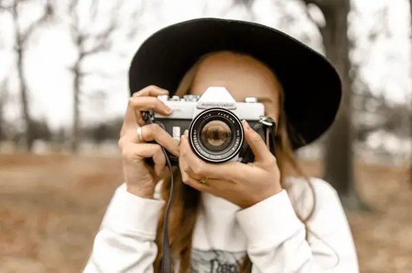 girl holding camera