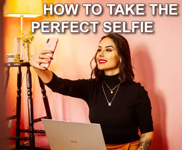 woman taking selfie with artificial light