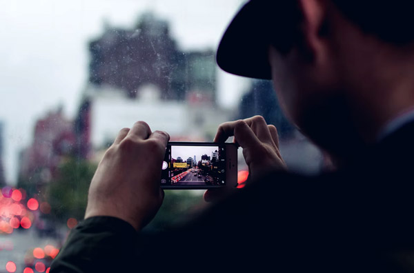 man shooting with phone