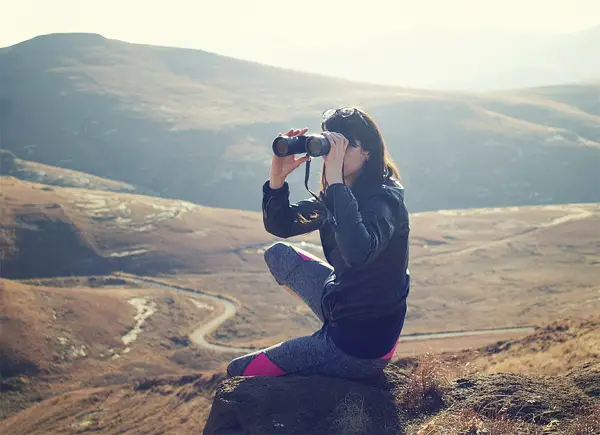 using binoculars to spot