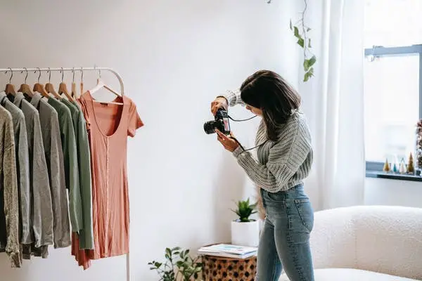 photographer taking pictures of clothes
