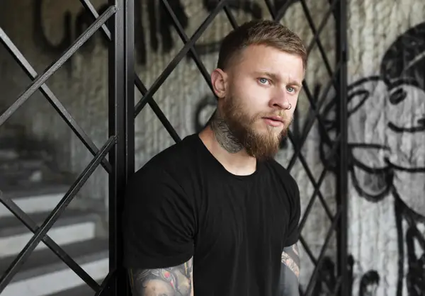 man in front of a staircase