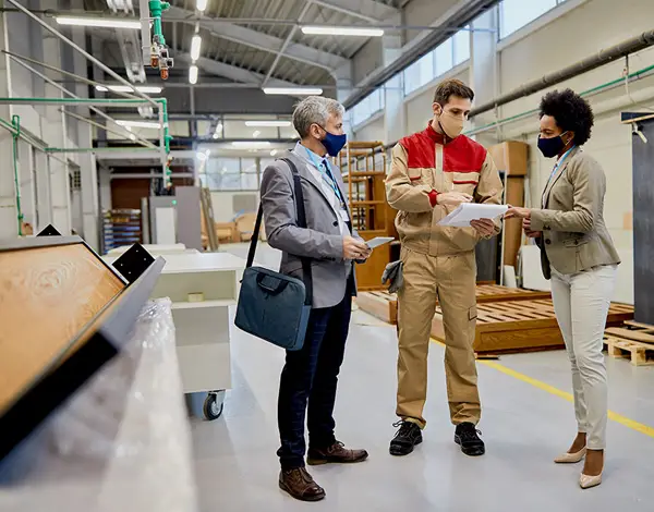 three workers in a factory