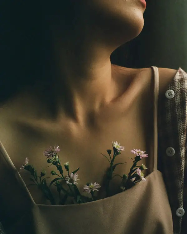 artistic photograph of a woman and flowers