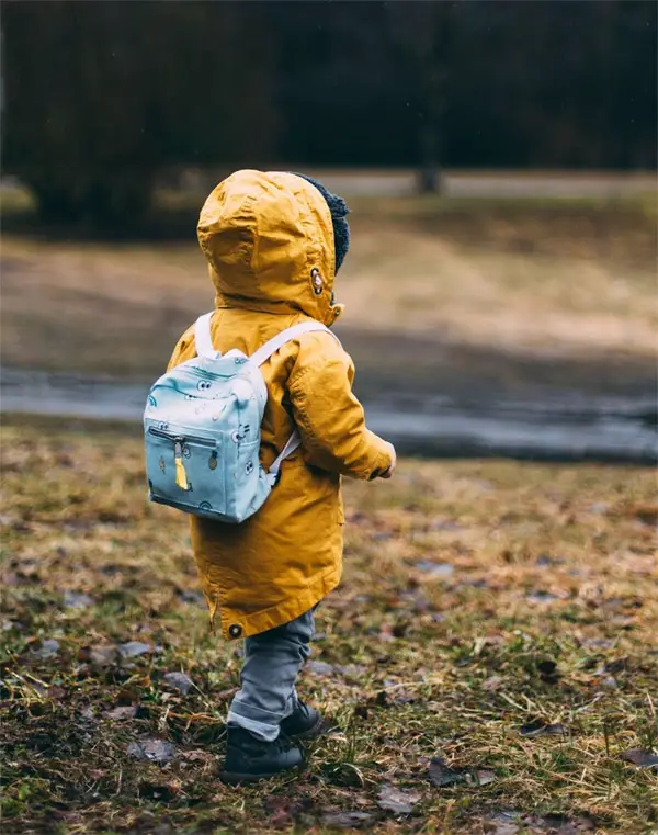 Boy walking in a park