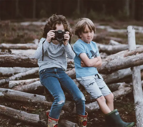 Girl taking photo of a scene