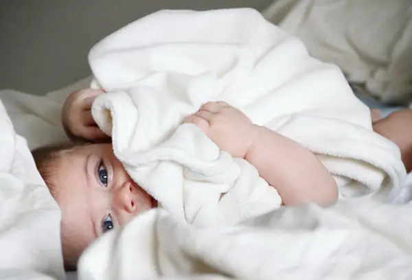 newborn wrapped in blanket
