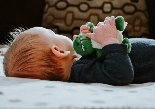 baby with stuffed animal