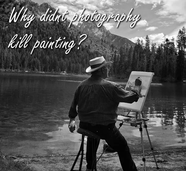 Photograph of man painting a landscape