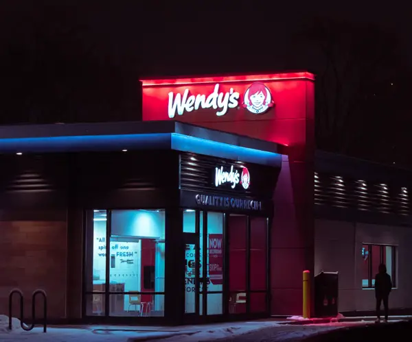 Night photograph of a restaurant and man