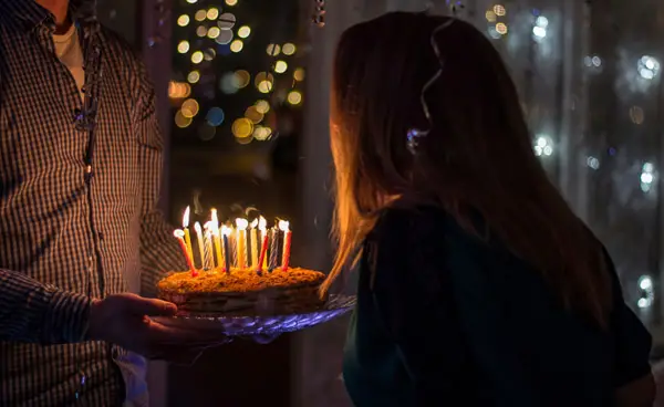 Birthday cake being blown out